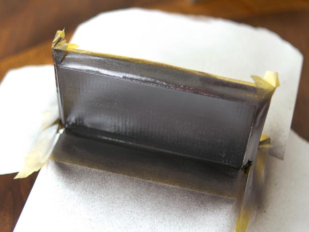 Spray on two coats of chalkboard paint, allowing dry time between coats (Image 2). Remove tape and paper once second coat is dry. Tip: When spraying, it's better to apply two thin coats over one thick coat. If dripping does occur, allow the coat to dry, sand and reapply paint.