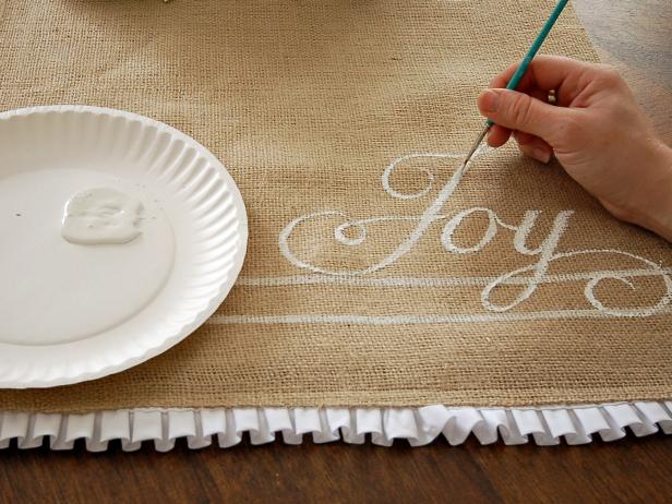 After painting, remove stencil and paint over lettering a second time to strengthen the lettering. Repeat on other side of runner, if desired. Allow paint to dry. Press runner prior to use. Spot clean stains when needed.
