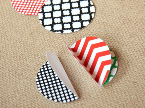 Use double-sided tape to attach three folded circles together back to back.
