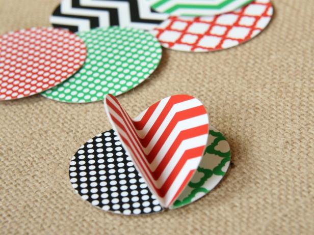Alternate patterns and colors as you attach three folded circles together back to back. You will have extra circles so you can create a variety of looks.