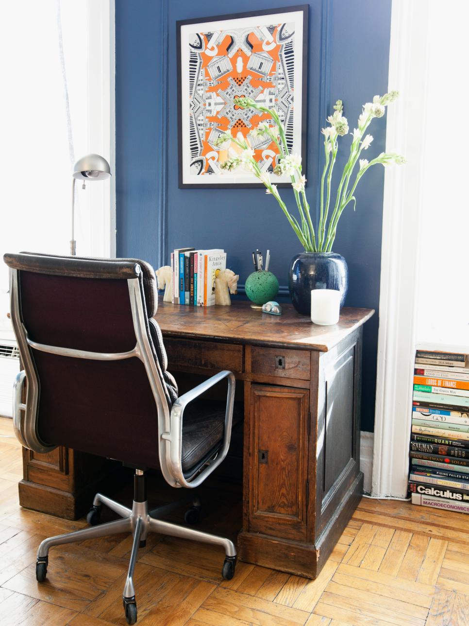 Blue Office Space With Art and Flowers