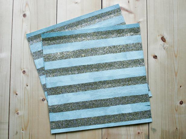 Paint exposed paper with mint-green paint. Once paint has dried, carefully remove tape to reveal tone-on-tone pattern.