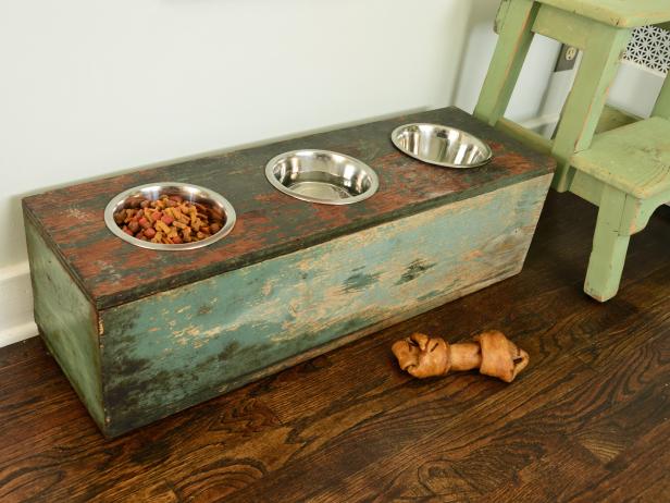 Create a custom feeding station that will make eating and drinking easier on your pet. Old wooden crates, boxes or stools can all be converted into a piece that's functional for your best friend and will look great in your home.