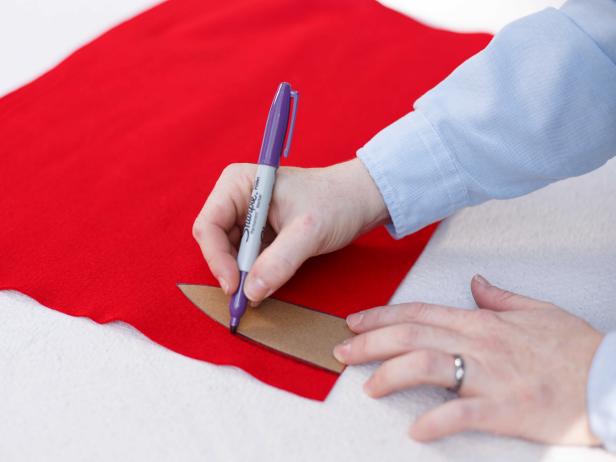 Use a stencil to trace an outline for the petals on a homemade felt poinsettia.