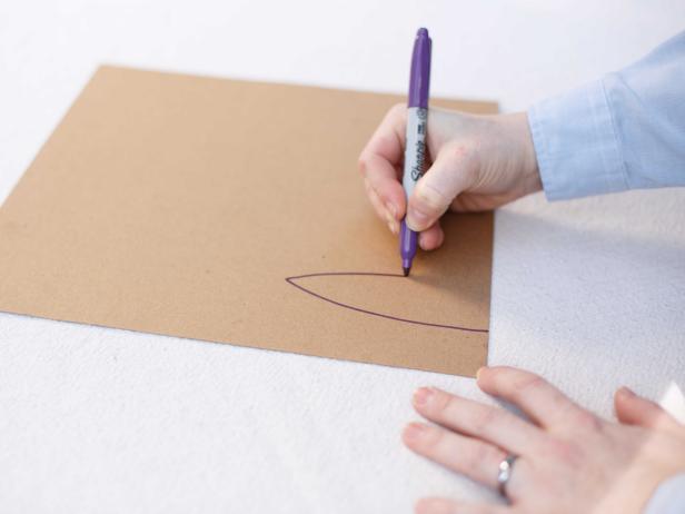 A marker or chalk can be used to trace a stencil onto paper or cardboard, aiding in creating uniform cutouts.