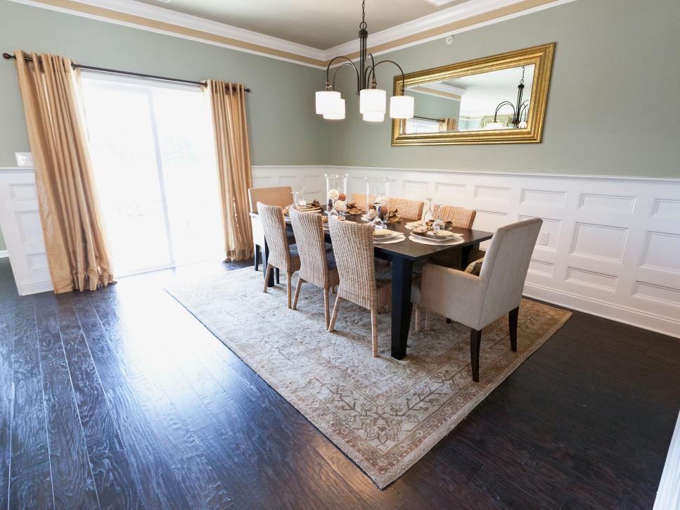 Transitional Dining Room With White Wainscoting and Crown Molding