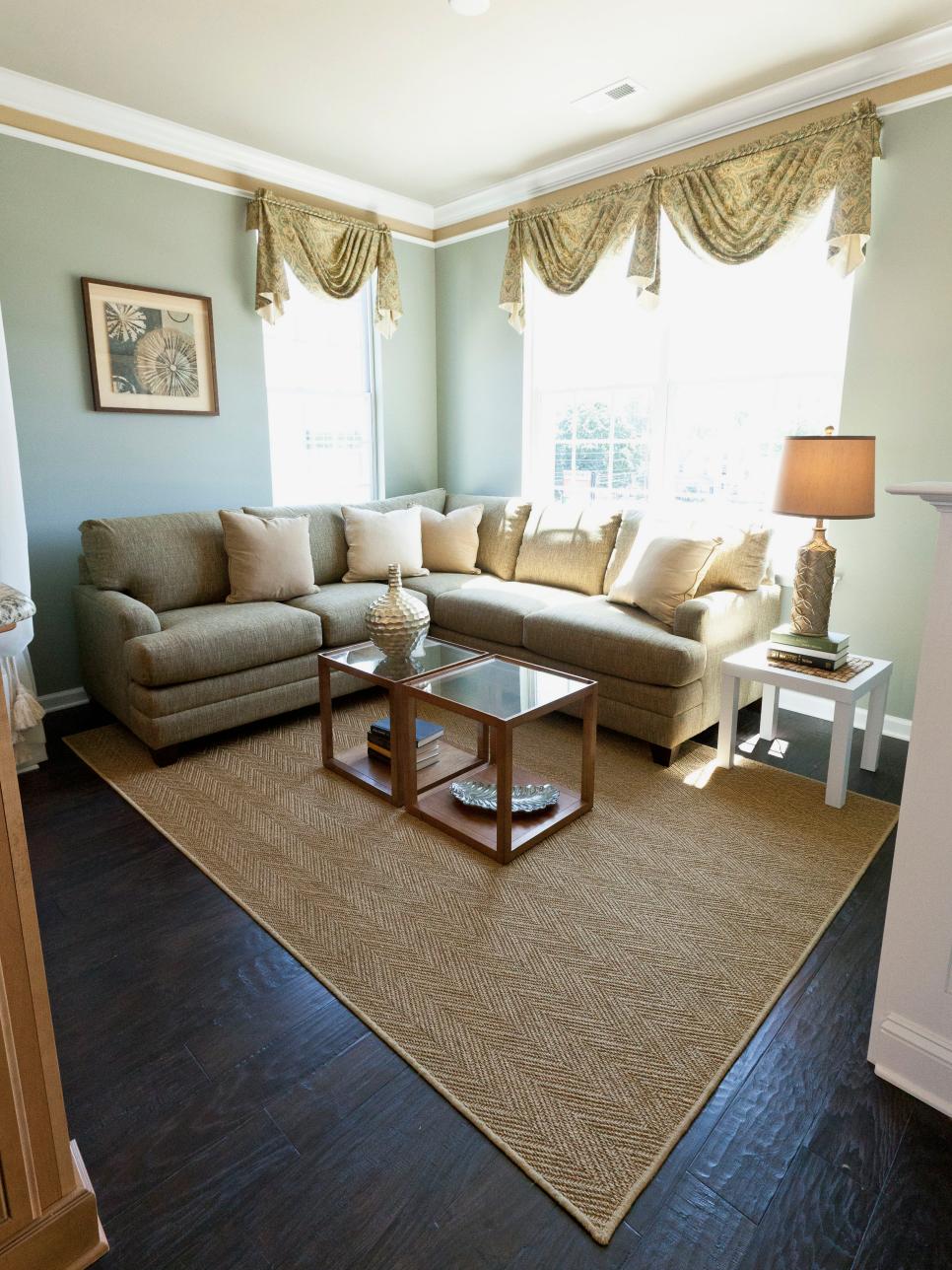 Tan and Green Living Room With Sectional Sofa and Area Rug