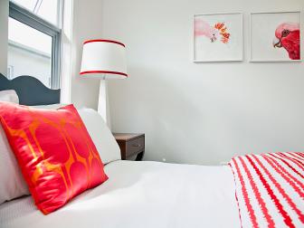 White Guest Bedroom With Bright Pink and Red Accents