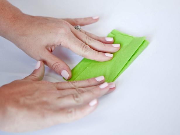 Fold tissue paper 4 times to create a beautiful and simple box for gift wrapping.