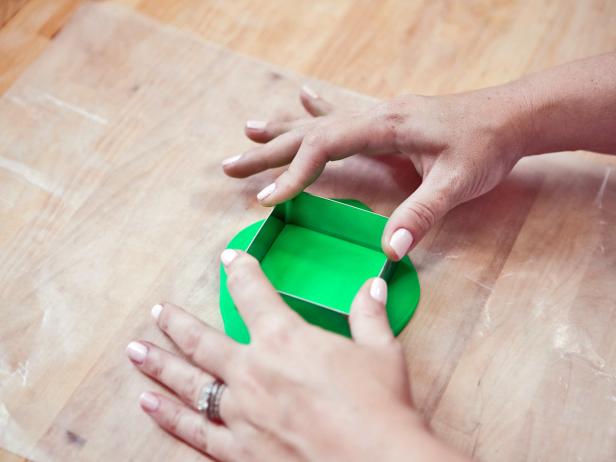 Press the cookie cutter into the rolled clay. Peel away the excess clay.