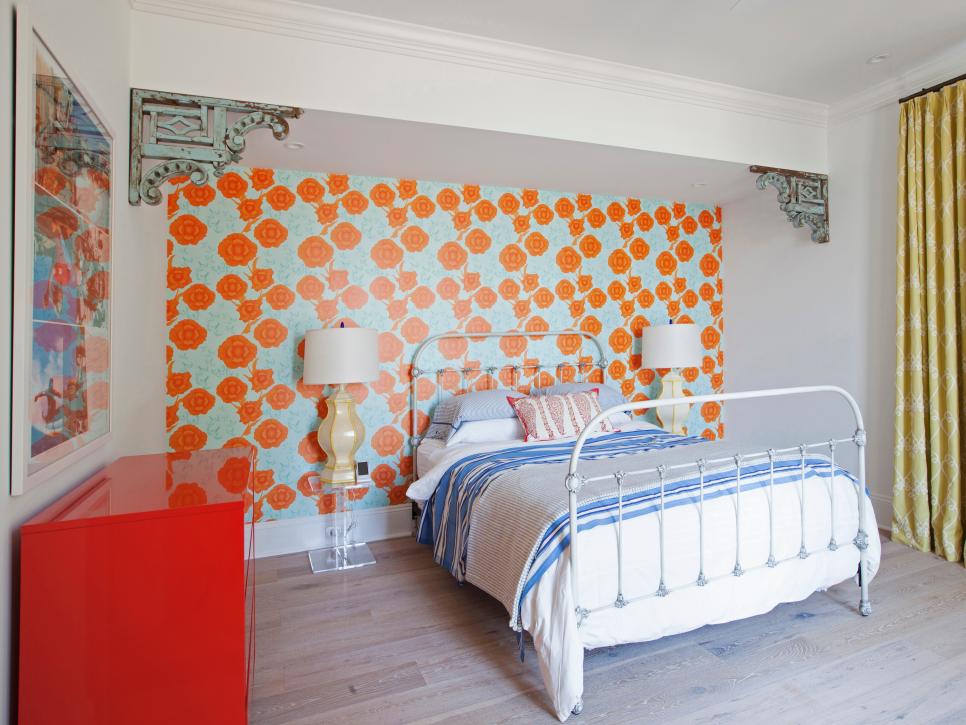Charming Bedroom With Orange and Blue Floral Wallpaper