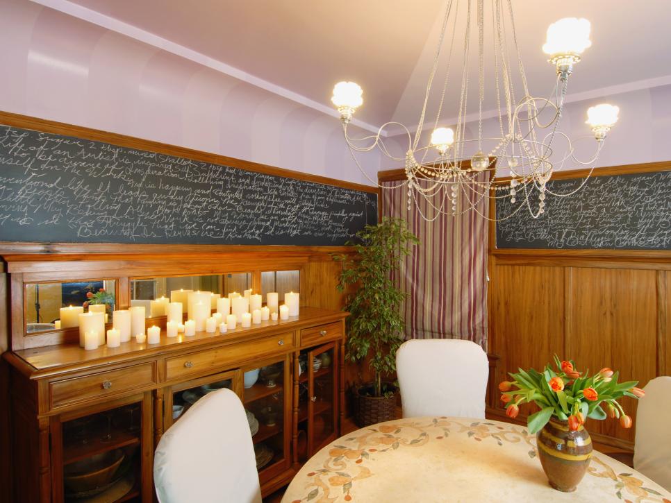 Traditional Dining Room With Chandelier, Wood Paneling and Chalkboard 