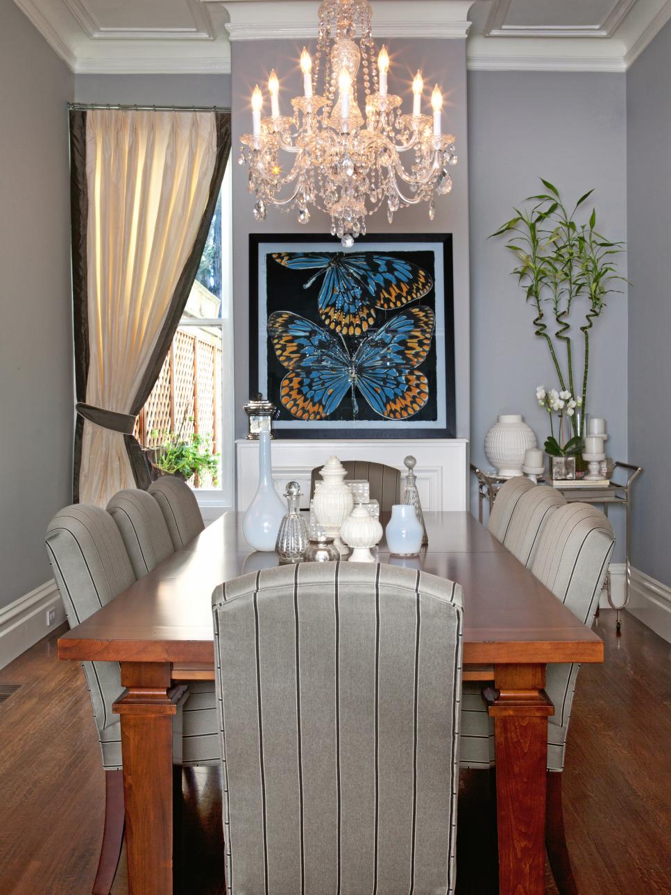 Transitional Gray Dining Room With Crystal Chandelier & Butterfly Art