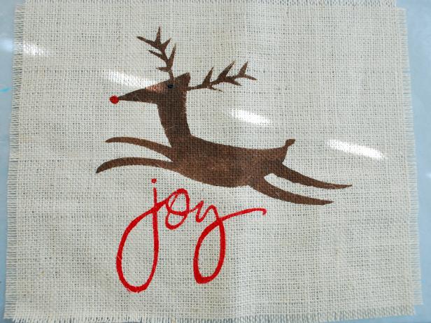 Use spray adhesive or spray mount on the back of your stencil and place on your burlap.Begin to paint. Make sure you use the "pounce" method so paint doesn't get under your stencil.