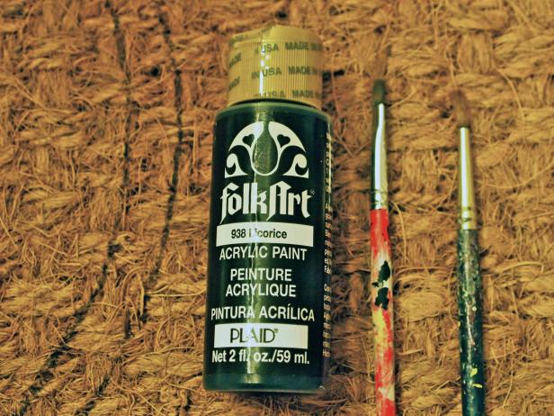 Using black craft paint and a small brush, fill in the circle and monogram.