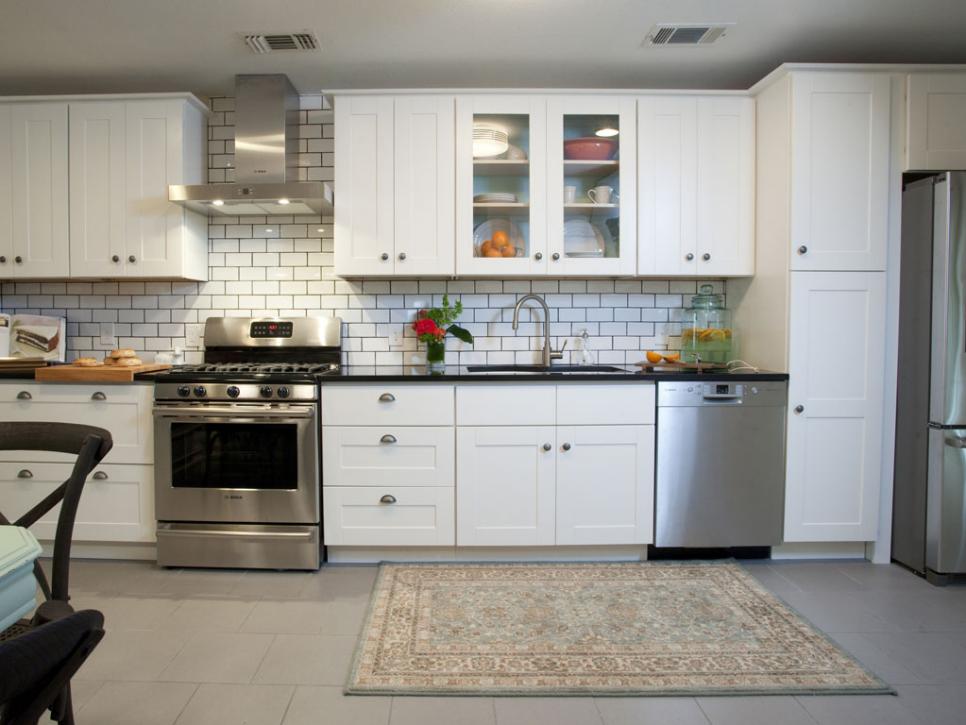 White Transitional Kitchen With Subway Tile Backsplash and Muted Rug