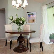 Simple Dining Room With Tufted Chairs
