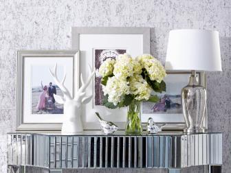 Mirrored Console Table With Silver and White Accessories 
