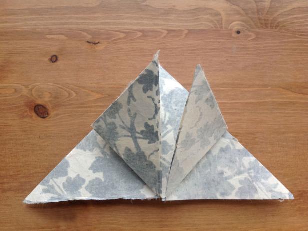 Repeat with right corner and bring towards top corner of triangle.
