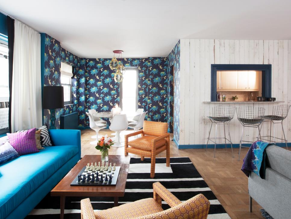 Blue Living Room With White Wood Paneling and Blue Floral Wallpaper