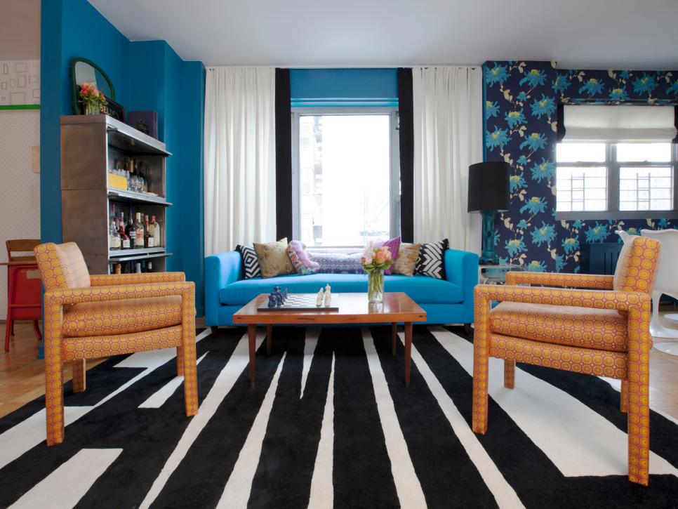 Blue Living Room With Black & White Rug, Orange Armchairs