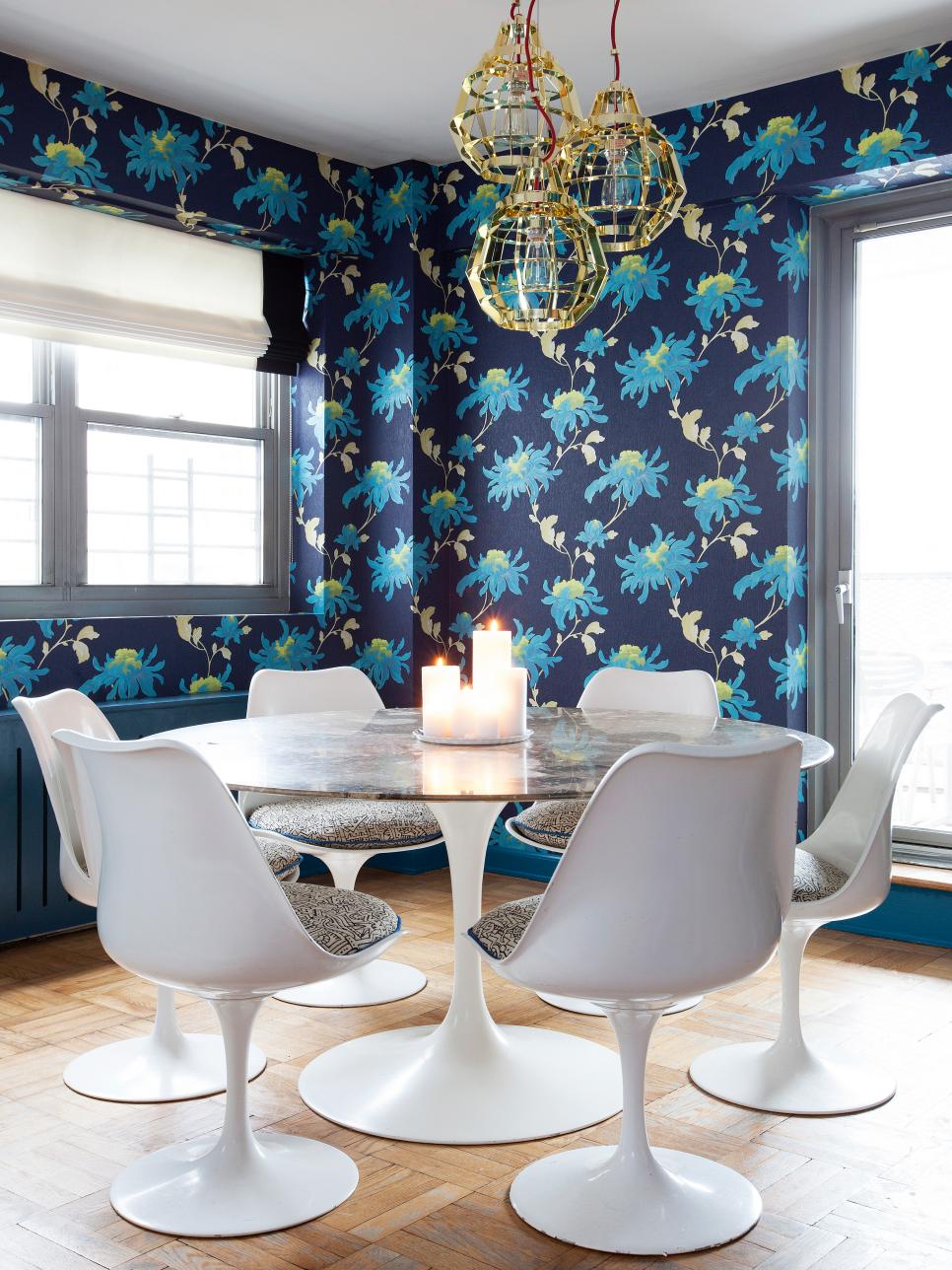 Dining Room With Blue Floral Wallpaper and Modern Pedestal Table