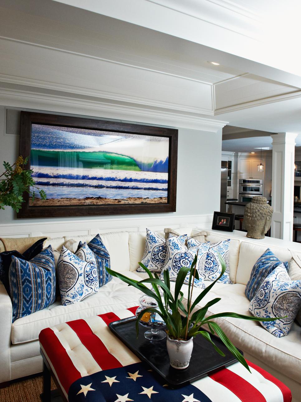 Transitional Living Room With American Flag Ottoman and White Sofa