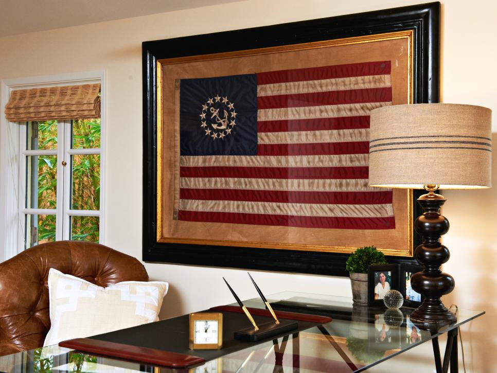 Framed Flag Above Glass Desk in Traditional Home Office