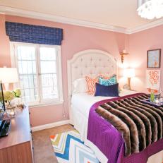 Eclectic Bedroom with Pink Walls and Orange and Blue Accents