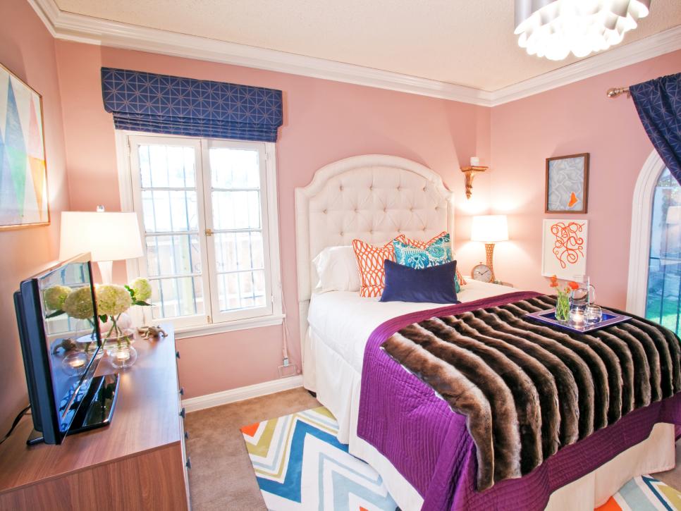 Eclectic Bedroom with Pink Walls and Dark Blue and Orange Accents