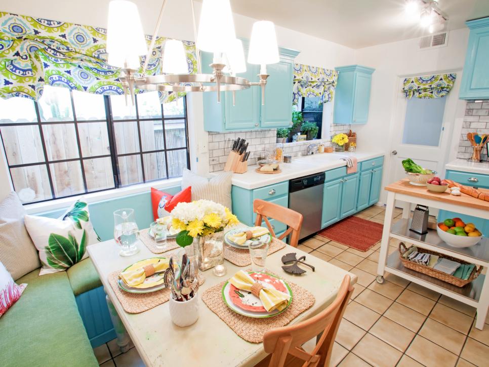 Blue kitchen with banquette and dining area