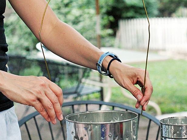 After you poked desired number of holes, it is time to attach your handles. Clip your hangers and bend them into long loops.