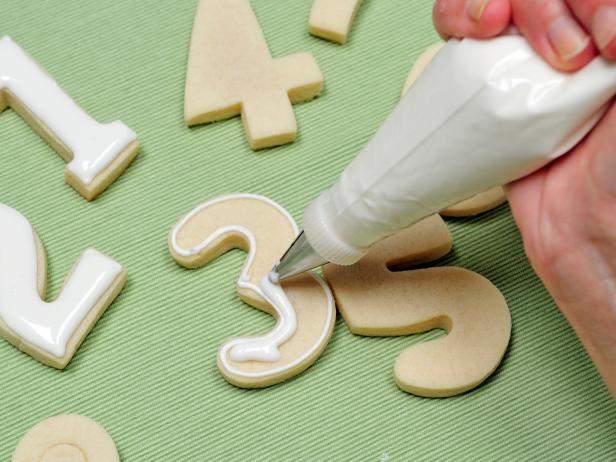 Then flood each cookie with a thinner icing.