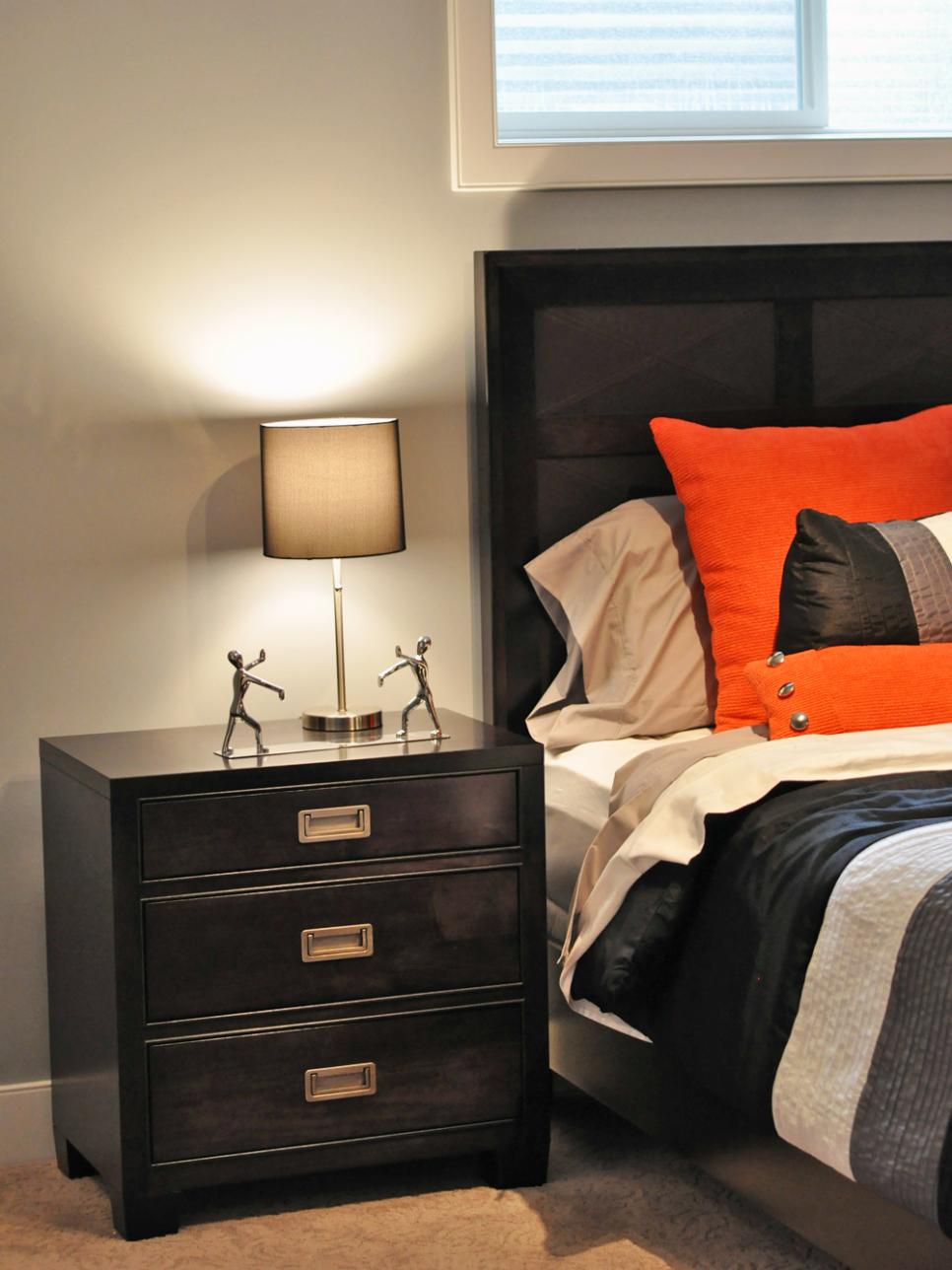 Sleek And Masculine Bedroom in Gray, Orange and Black