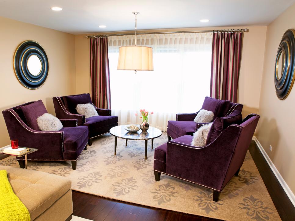 Neutral Living Room With Purple Chairs, Fur Pillows and Round Mirrors