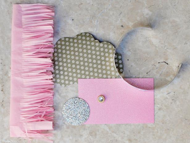 Attach the tiara cutout to the original foil headband using hot glue.