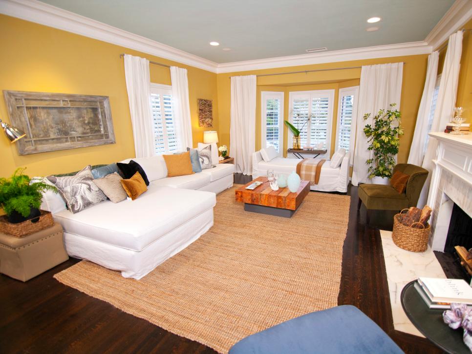 Yellow Living Room With a Marble Fireplace