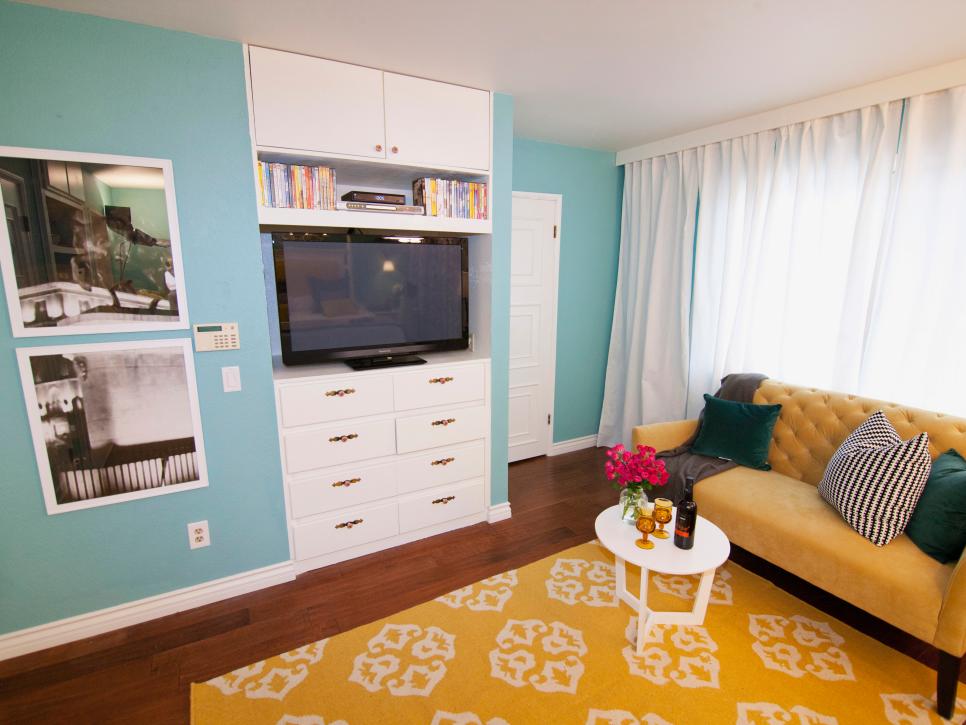 Bedroom transformed to TV room with built-in cabinet. 