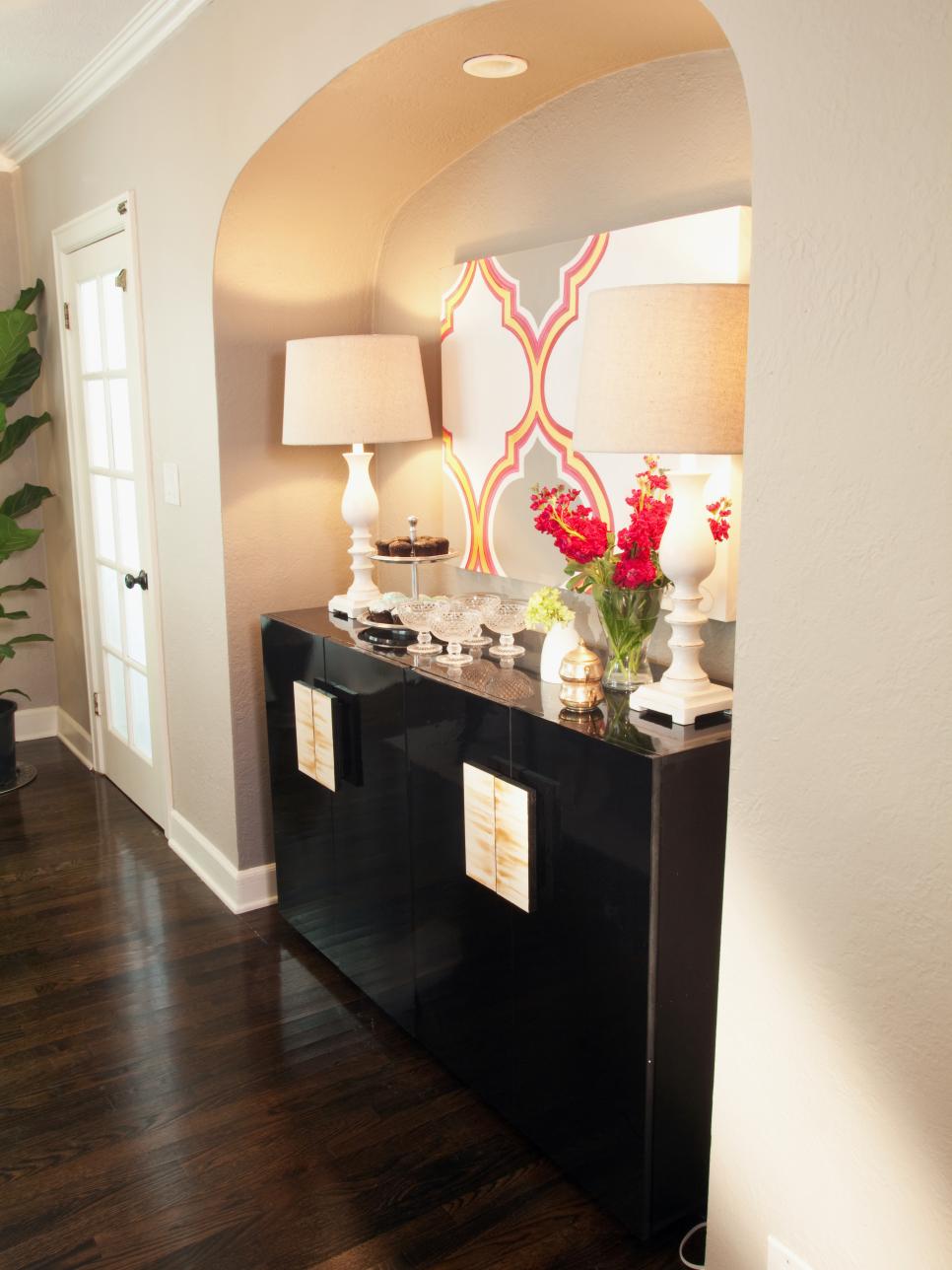 Dining Room Black High-Gloss Sideboard With White Lamps in Alcove