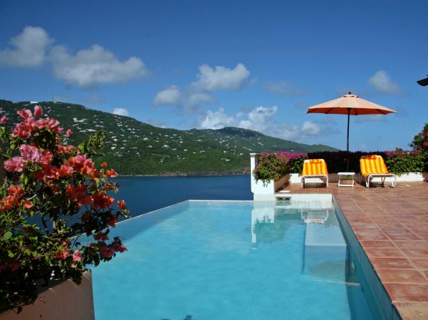 Tropical Infinity Pool With Lounge Chairs and Umbrella Tropical Infinity Pool With Lounge Chairs and Umbrella