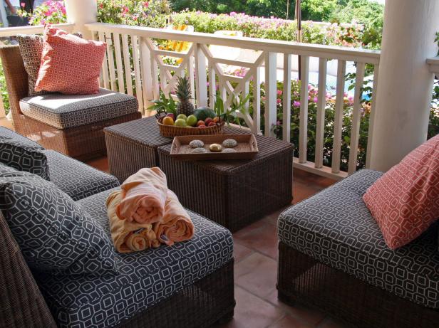 Cottage Porch With Wicker Furniture and Patterned Cushions Cottage Porch With Wicker Furniture and Patterned Cushions