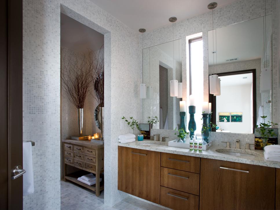 Bathroom With White Tile Walls, Hickory Vanity Cabinets and Slim Pendants