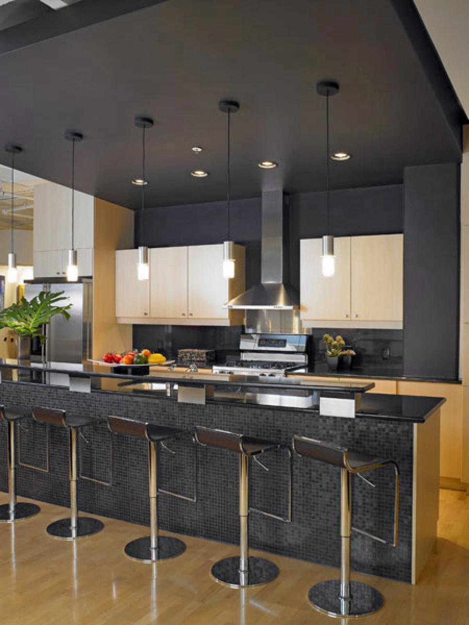 Black Contemporary Eat-In Kitchen with Light Wood Cabinetry