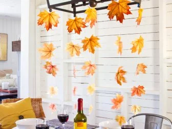 Fall leaves hanging from dining room chandelier