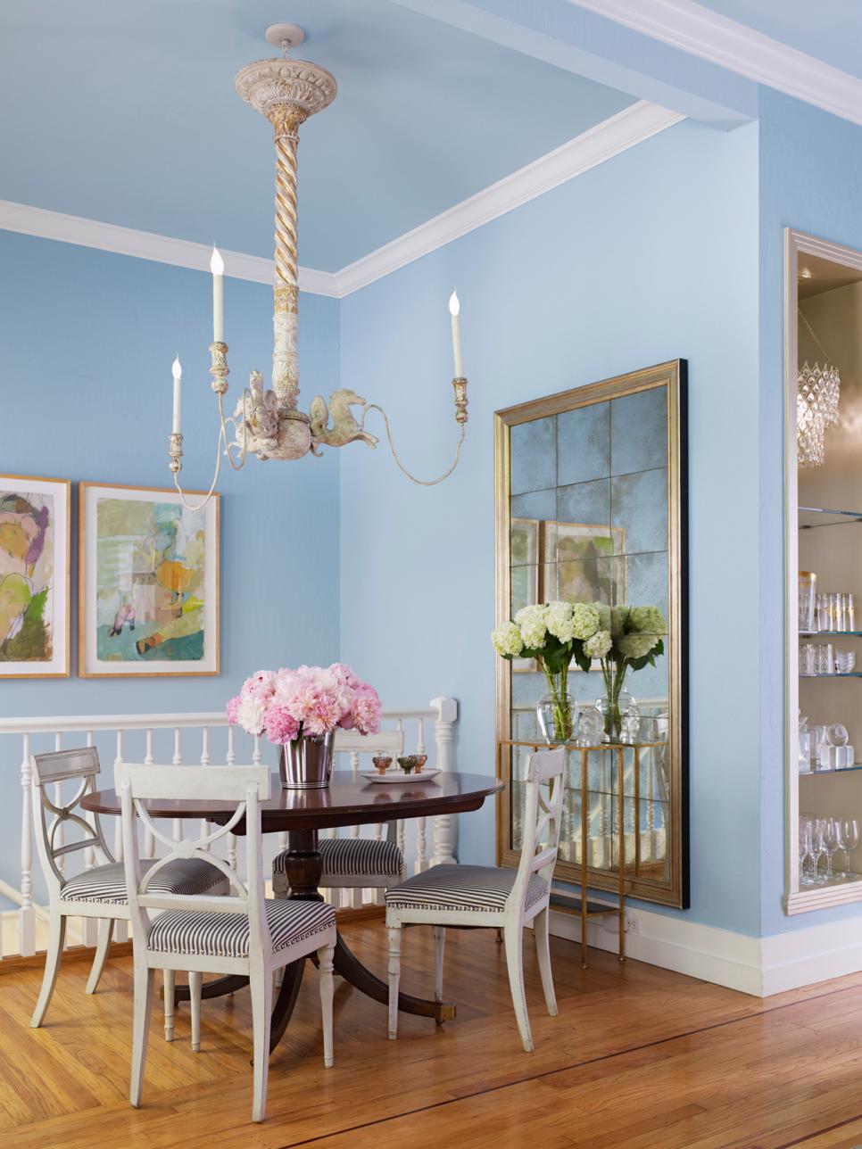 Light Blue Dining Room With Vintage Chandelier and Antiqued Mirror