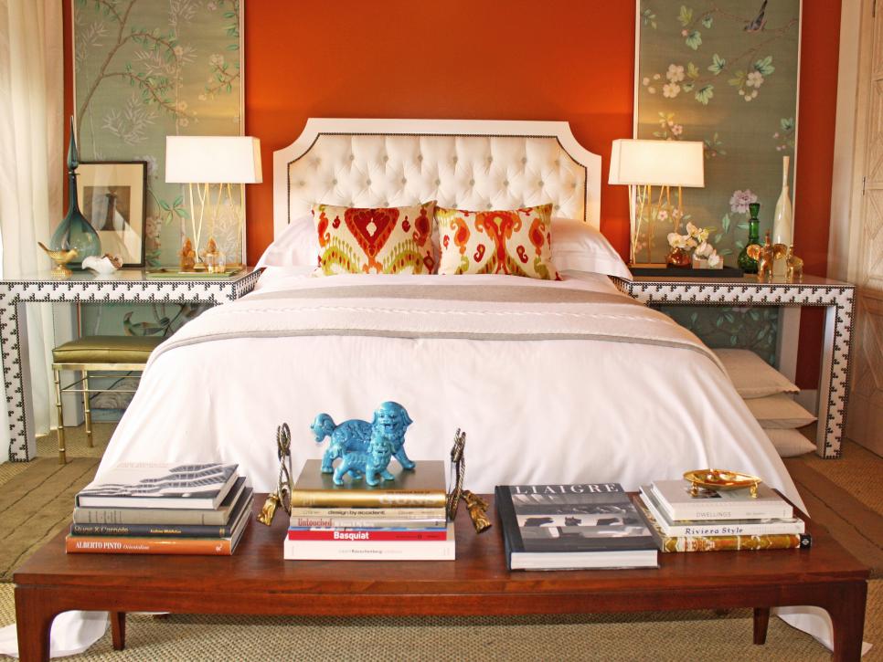 Red Bedroom With Asian-Inspired Wall Panels and White Bed