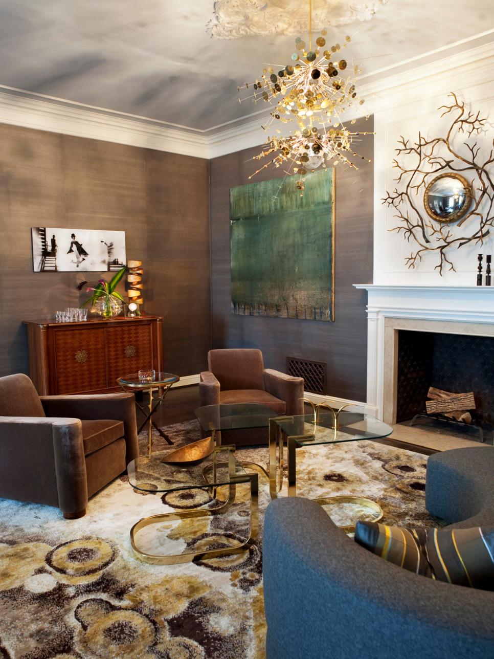 Gold and Gray Living Room With Unique Light Fixture and Wall Art