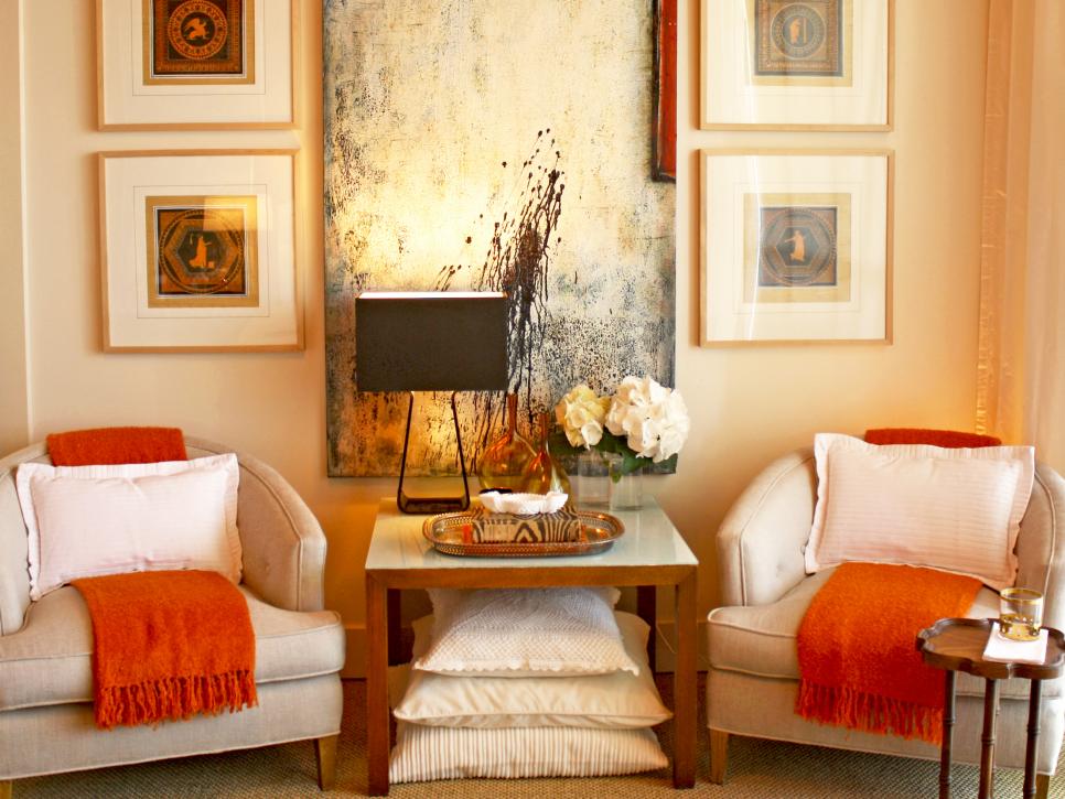 Neutral Seating Area With Framed Art and midcentury Modern Chairs