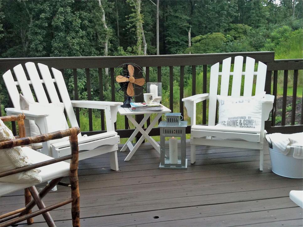 Country Deck with White Adirondack Chairs