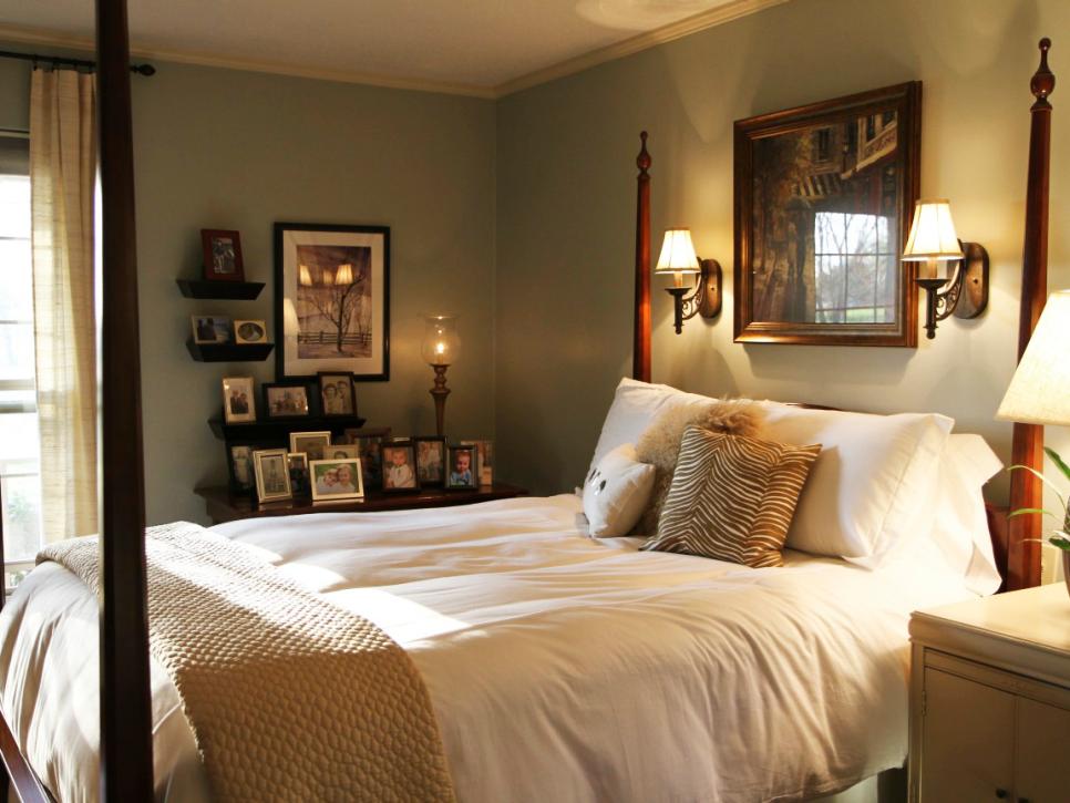 Traditional Bedroom With Framed Photos and Wood Poster Bed